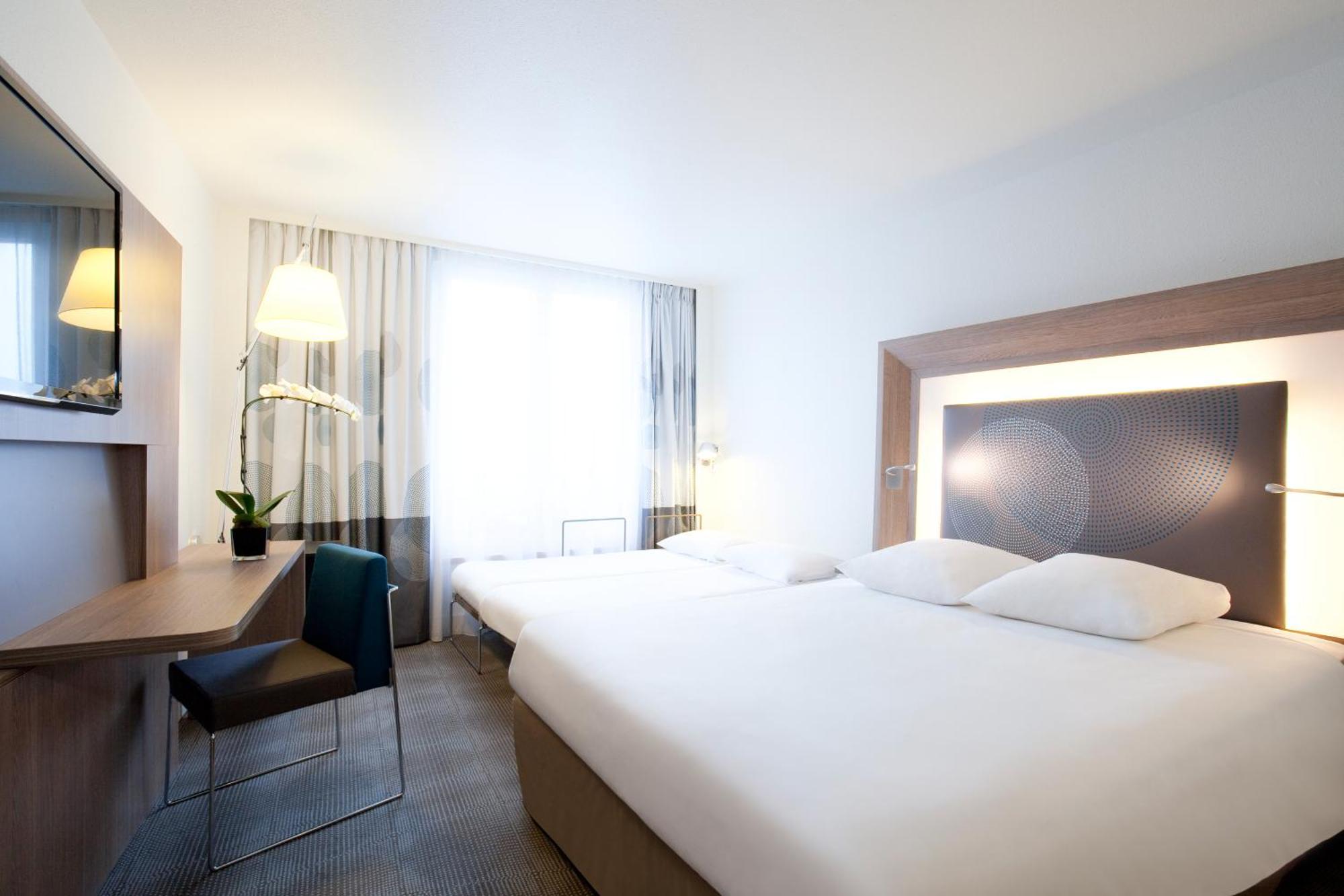 Superior Kamer met Queensize Bed en 2 Aparte Bedden Slaapbank