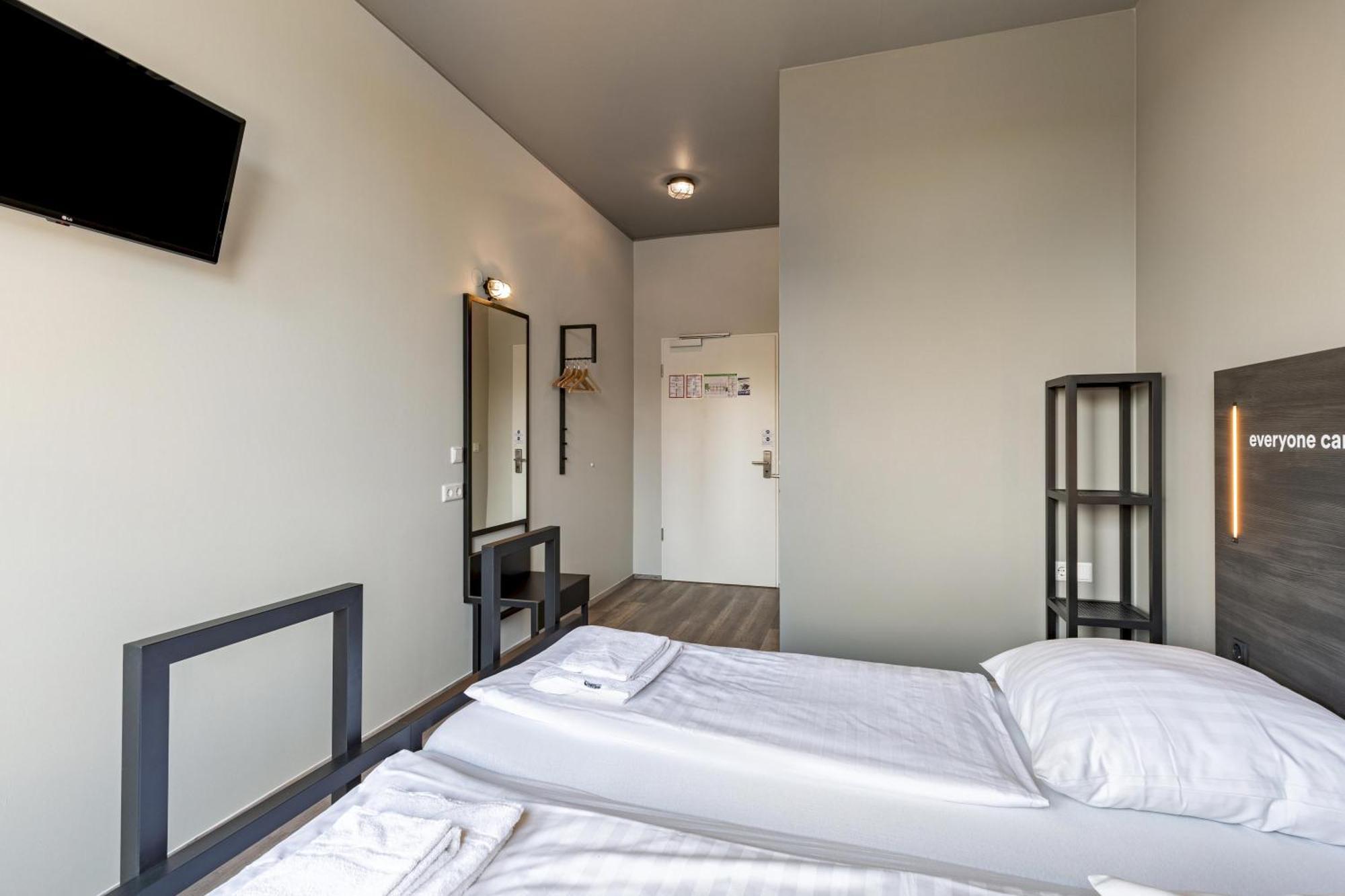 Kamer met twee aparte bedden voor eenpersoonsgebruik