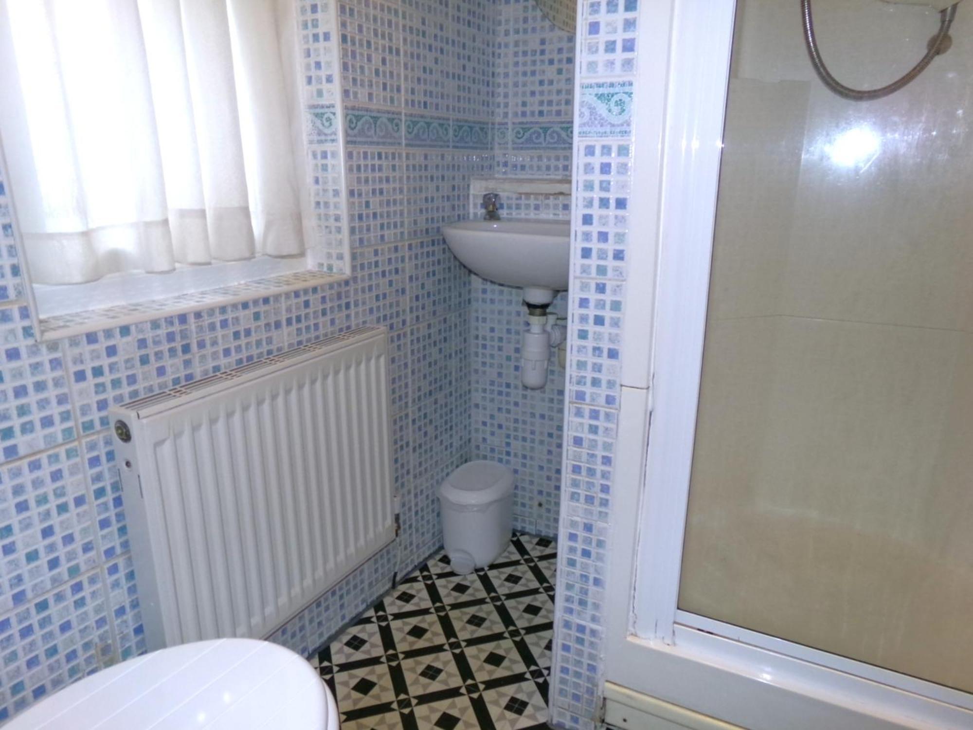 Single room shared toilet shower