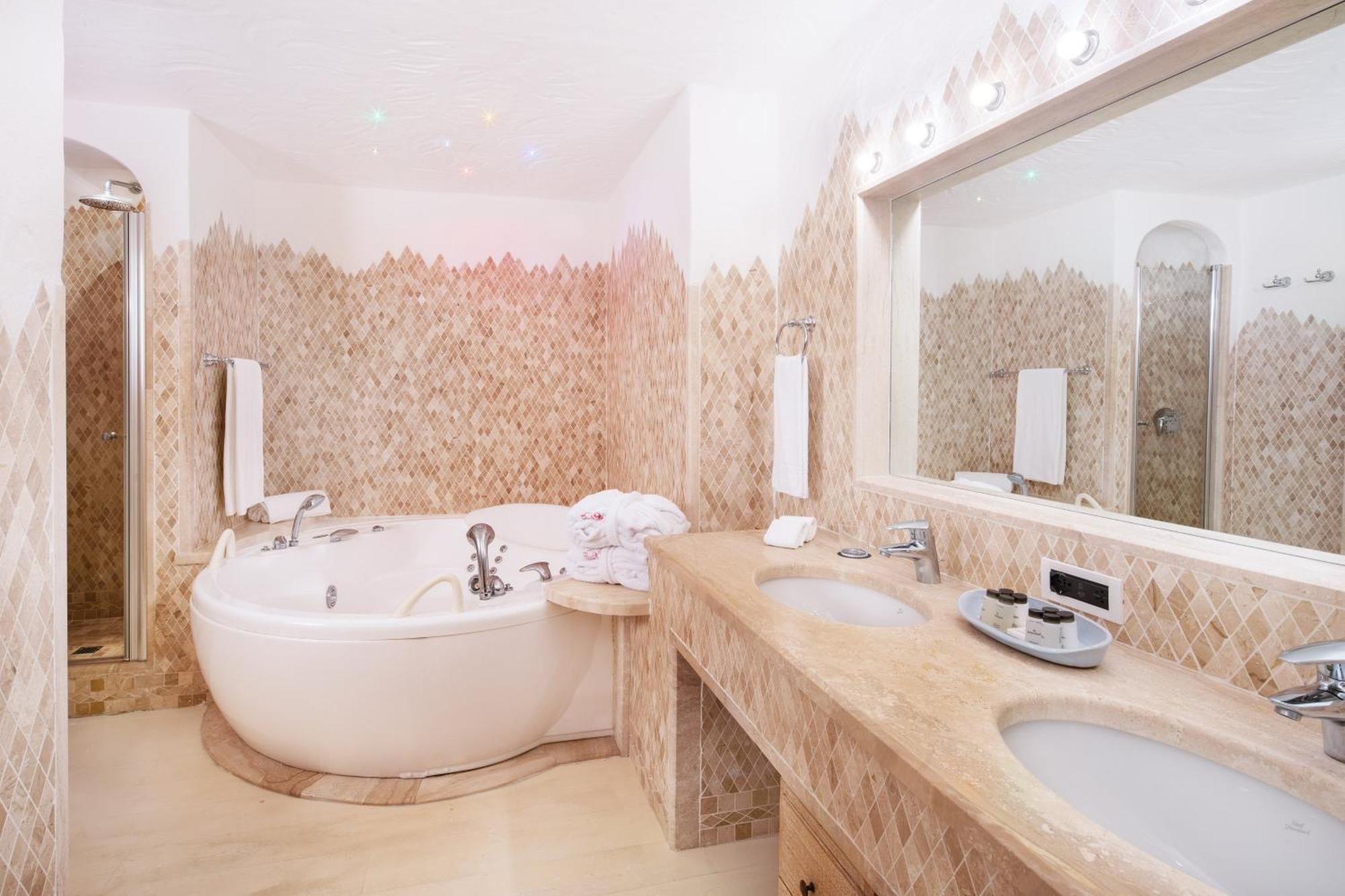 Two-bedroom Deluxe Suite King size bed pool or canal view terrace